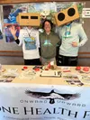 Louisa Branchflower welcomes guests alongside featured performers The Robotz during the 2025 One Health Festival at the Palmer Train Depot, this year’s event honors Mat-Su farmers, fishermen,