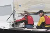 Below: Bruce Lee and sailing partner Greg Barta prepare to race
an International 505 sailboat. (HEATHER A. RESZ)