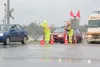 ROBERT DeBERRY/Frontiersman Alaska State Fair traffic flaggers
set out cones and direct motorists Saturday afternoon at the
intersection of Inner Springer Loop Road and the Glenn Highway.