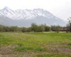 This field behind Swanson Elementary in Palmer will become a
construction site this summer as contractors build a new $10
million Sherrod Elementary, slated to open in fall 2003. In the
dista