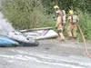 Courtesy photo/Alaska State Troopers Firefighters work to
extinguish the burning wreckage of a small plane that crashed
Tuesday, claiming two lives.