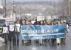 A group of about 50 people walk down South Alaska Street in
Palmer Thursday afternoon during a Choose Respect March. (ROBERT
DeBERRY/Frontiersman)