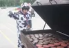 GREG JOHNSON/Frontiersman Elsie the Cow (aka Linda Jo
Klapperich) reacts with mock shock and horror to see her fellow
bovines on the grill at Saturday’s Governor’s Family Picnic at the
Alaska
