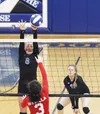 Mariah McNamara reaches for a block during a 3-2 win over the Wasilla Warriors. Jeremiah Bartz/Frontiersman