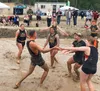 The Vegas Bombs celebrate a point during the Big Lake Lions Club Mud Volleyball Tournament. Jacob Mann/Frontiersman