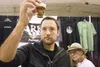 An attendee checks the floor on a glass of beer from Arkose Brewery in Palmer during the 2013 Mighty Matanuska Brewfest. The annual brewfest is from 6 to 10 p.m., Friday and Saturday at Raven