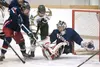 Colony's Logan Sanders gets in the mix in front of the North Pole Patriots goal during Thursday game at the Big Lake Lions Recreation and Community Center. ROBERT DeBERRY/Frontiersman.com