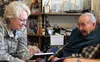 Nick Abalama Sr. and Brigadier General Laurie Hummel laugh together before a ceremony recognizing Abalama’s service in the Alaska Territorial Guard. Family and friends filled Abalama’s home a