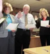 MICHAEL ROVITO/Frontiersman New Wasilla City Council members are
sworn in, from left, Nancy Hall, Ron Cox and Leone Harris.