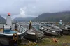 Skiffs sit on shore in the Southwest Alaska fishing town of King Cove.  Photo by James Brooks via Flickr under Creative Commons license