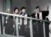 Mat-Su Central graduates wave to the crowd from the upper track of the Menard Sports Center. Jeremiah Bartz/Frontiersman