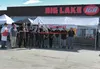Manager Jerry Hill cuts the ribbon during a grand opening celebration June 7 for the Big Lake IGA. The store had served the community under the name Steve’s Food Boy, but a switch to purchasi