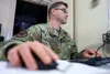 JOINT BASE ELMENDORF-RICHARDSON, Alaska -- Alaska Air National Guard Master Sgt. Micah Weeks, 176th Communications Flight, operates his console July 22, 2021, during Cyber Shield 21 at Joint 