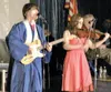 WILL ELLIOTT/Frontiersman Palmer High School graduates Morgan
Scoresby, left, and Kendra Walker perform “When You Believe” during
Friday night’s graduation ceremony.