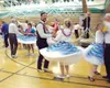 Skirts swirl as dancers twirl around Gary Feaster, chair of this
year's state square dance festival and a member of the local club,
Paws &amp; Taws. The festival attracted 150 dancers from ar