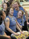 Members of Team Alaska Hand Games, Open Female, celebrate winning a round during the championship match against Team Yukon on March 13, 2024 at the Menard Center in Wasilla. The team won Silv