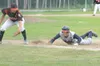 ROBERT DeBERRY/Frontiersman Alaska Road Warrior Tommy Rodamer
dives back to first base during Saturday’s game against West at
Oberg Field.