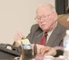 Lee Jordan, president of the Matanuska Electric Association
board of directors, goes over notes at the March board meeting.
When asked recently about MEA’s plan for dealing with potentially
t