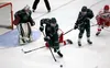 Colony defenseman sweeps a puck away from the crease during a 3-1 win over Wasilla in the Division I state tournament fourth-place game Saturday in Wasilla. Courtesy of Bruce Eggleston/matsus
