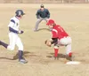 Wasilla senior Corey Cowgill steps on the bag to get the out on
first during the fourth inning of a 19-3 loss to Homer on Friday at
Carl Fritzler Field. Palmer edged WHS 6-3 on Saturday. ROBE