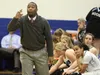 First-year head coach Elgin Hollins motivates his players from the sideline during Palmer's 53-41 girls' basketball win over Thunder Mountain Jan. 7 at Palmer High School. JEREMIAH BARTZ/Fron