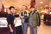 Eric Vue helps Logan Christianson and Yorik Loebs Christmas shop at the 5th Avenue Mall in Anchorage.  Courtesy photo