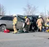 ANDREW WELLNER/Frontiersman Firefighters remove a patient from
an accident that tied up the Parks Highway Monday morning. Two
people died in the collision.