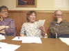 Katherine Fueller shares a poem she wrote about a beagle she
saved from the shelter as retired geophysicist Dave Mathews and
others listen during a poetry workshop at Palmer Senior Center
Wed