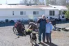 Sid and Carol Glasscock and dog Kalijah, of Knik, stand outside their home on Lori-Lynn Circle Tuesday afternoon. CHRIS FORD/Frontiersman.com