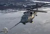 An HH-60 Pave Hawk assigned to the 210th Rescue Squadron, Alaska Air National Guard, conducts aerial refueling from a HC-130J Combat King II assigned to the 211th Rescue Squadron, Alaska Air 