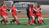 The Wasilla girls soccer team celebrates its Northern Lights Conference championship Saturday at Ed Hollier Field in Kenai. Photo by Joey Klecka/Peninsula Clarion