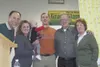 The big winners, right, celebrate during the Mat-Su Miners Grand
Slam Raffle in late April. Jason Johnson, middle, and his family,
and Robert and Linda Plumley, left, held the final tickets d