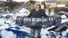 Hope for Heroes Chief Operations Officer Jennifer Baker stands in front of the rubble that was once the charity’s headquarters holding a banner that survived a Jan. 20 fire. The charity is wo