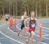 Wasilla's Lane Reed leads a group of Valley runners across the Machetanz Field track during the 4A boys race of the Palmer Invitational Saturday in Palmer. Reed helped Wasilla win the boys te