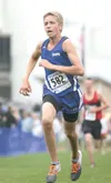 Palmer freshman Wyatt Peltier sprints toward the finish during
the Palmer Invitational at Palmer High School last week. On
Tuesday, Peltier finished fifth to help the Palmer boys win a
Mat-Su