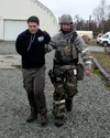 U.S. Air Force Staff Sgt. Steven Garwood, the 673d Security Forces Squadron noncommissioned officer in charge of confinement, detains a simulated intruder who breached the base’s perimeter du
