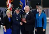 Jay Hone, spouse of Secretary of the Air Force Heather Wilson, is presented an award by Air Force Chief of Staff Gen. David L. Goldfein during the SECAF’s farewell ceremony at Joint Base Andr