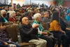 Vic Fischer, the last surviving author of Alaska’s constitution, sits with wife Jane Angvik and listens to U.S. Senate candidates speak at the Oct. 22, 2022, forum at the Alaska Federation of