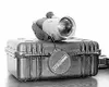 The hand-held forward looking infrared device, or FLIR, is a
thermal imaging camera that can be used to detect subtle variations
in temperature. SCOTT CHRISTIANSEN/Frontiersman