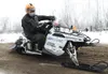 ROBERT DeBERRY/Frontiersman Aaron Loyer speeds around a snow and
dirt berm Sunday during the first few minutes of the 2010 Iron Dog
snowmachine race.