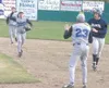 Palmer second baseman Tommy Brown, left, charges toward first
after the Moose caught Soldotna sophomore Steven Steger, right, on
the basepath in the top of the third inning. PHS first baseman