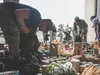 Joint Base Elmendorf-Richardson service members donate canned goods near the end of a POW/MIA ruck march through JBER, Alaska, Sept. 21, 2018. POW/MIA recognition day is observed every year o