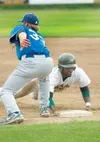 ROBERT DeBERRY/Frontiersman Mat-Su Miners outfielder Pablo
Bermudez dives back to first base during Saturday’s game at Hermon
Brothers Field in Palmer.