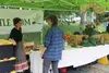 Zoe Fuller talks to a customer at the Mat-Su Community Farmers Market Jacob Mann/Frontiersman