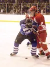 Palmer's Jonah Stewart wrestles with Wasilla's Andrew Tumbleson
for the puck in Palmer's win over Wasilla earlier this season.
Stewart is among the Moose players to be honored on senior night