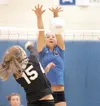 ROBERT DeBERRY/Frontiersman Palmer's Sarah Svedin blocks the
ball during game one of the Northern Lights Conference Volleyball
Championships at Palmer High School.