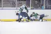 ROBERT DeBERRY/Frontiersman Alaska defenseman Chase Van Allen
watches as a pair of players fall to the ice during an win over
Wenatchee earlier this year. Robert DeBerry