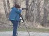 Wildlife photographer Sandee Rice takes pictures of hundreds of
sandhill cranes gathered and resting in the fields near the Palmer
airport. Rice shoots with a long lens to avoid spooking or
d