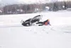 Al Palma Jr. slides across the ice after losing control during
the open class snowmachine ice race. ROBERT
DeBERRY/Frontiersman