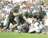 ROBERT DeBERRY/Frontiersman A pack of Colony Knights takes down
North Pole quarterback Lee Jones during Colony’s 17-7 win at Colony
High School.